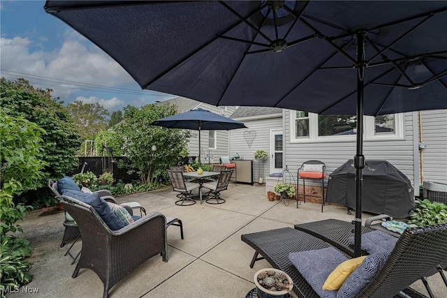 view of patio featuring an outdoor living space and grilling area