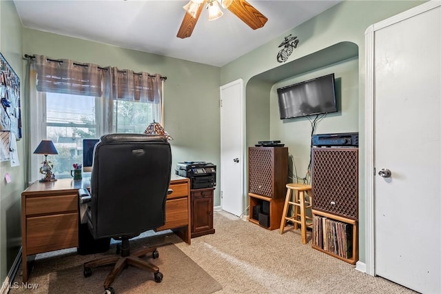 carpeted office with ceiling fan