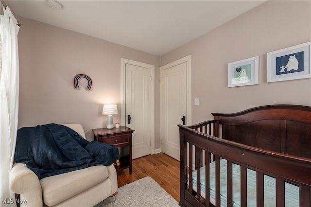 bedroom with wood finished floors