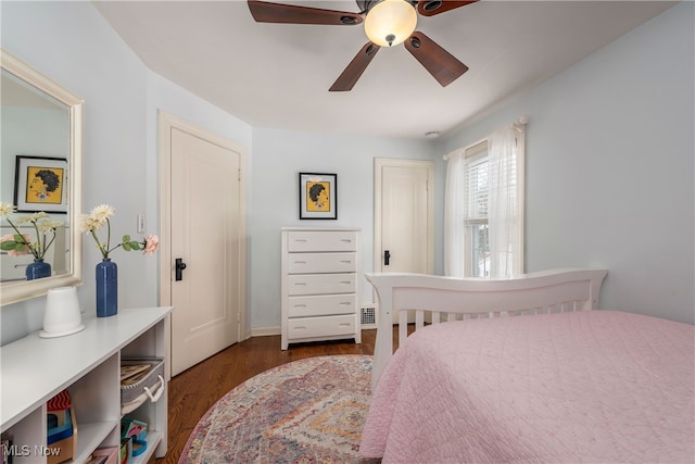 bedroom with a ceiling fan and wood finished floors