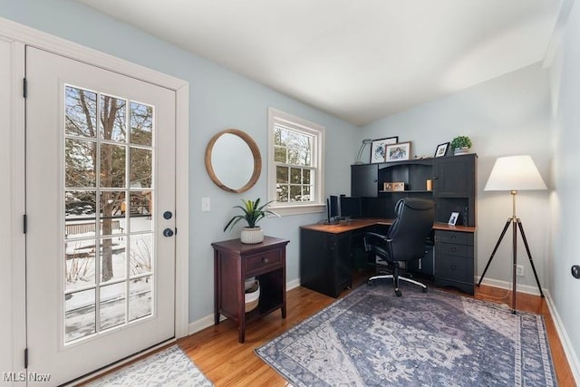 office area with light wood-type flooring and baseboards