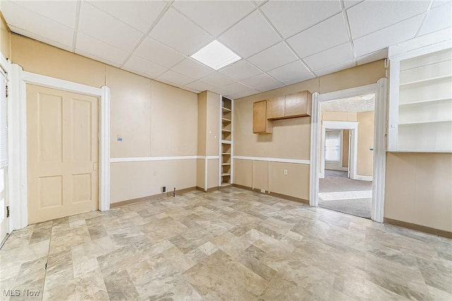 spare room featuring a drop ceiling