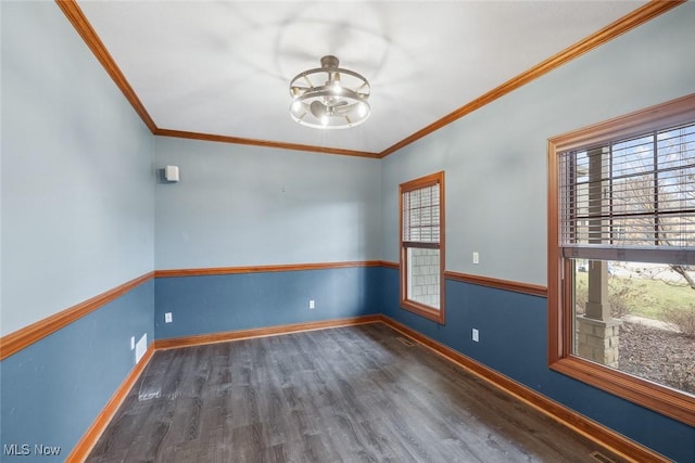 6470 Aberdeen Ln, Medina, OH 44256 - spare room featuring plenty of natural light, wood finished floors, crown molding, baseboards, and ceiling fan