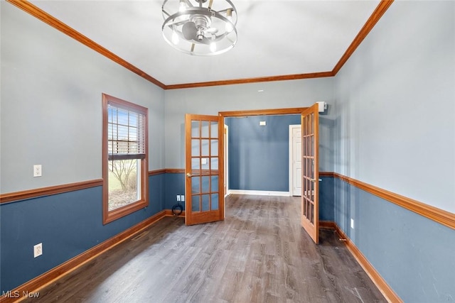 6470 Aberdeen Ln, Medina, OH 44256 - spare room featuring french doors, wood finished floors, crown molding, and baseboards