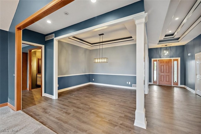 6470 Aberdeen Ln, Medina, OH 44256 - foyer entrance featuring a raised ceiling, ornamental molding, baseboards, wood finished floors, and a chandelier