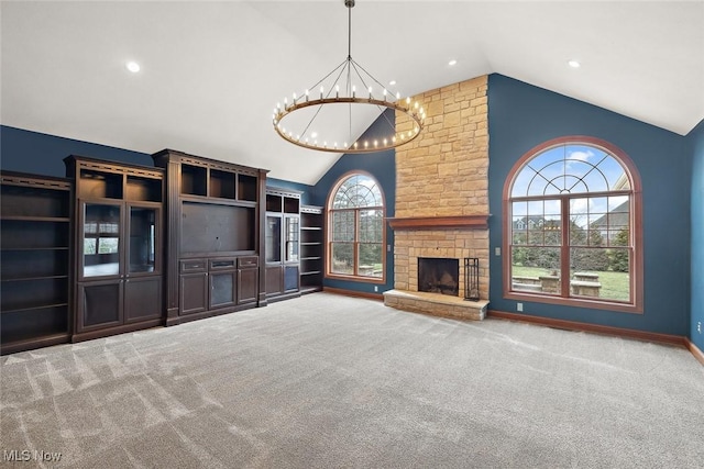 6470 Aberdeen Ln, Medina, OH 44256 - unfurnished living room featuring a chandelier, carpet flooring, high vaulted ceiling, a fireplace, and recessed lighting