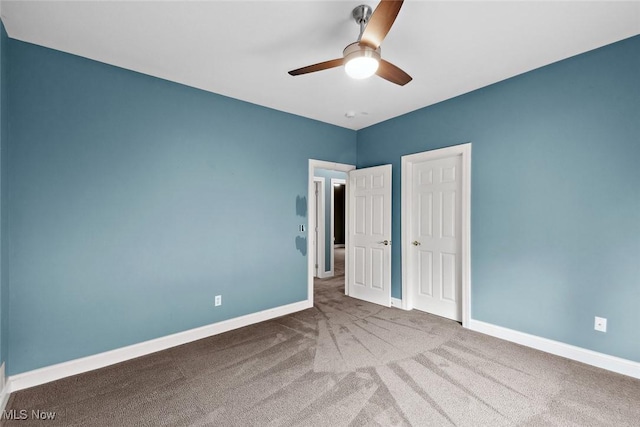 6470 Aberdeen Ln, Medina, OH 44256 - unfurnished bedroom featuring carpet flooring, baseboards, and ceiling fan