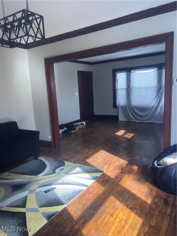 living room with dark wood-style floors and baseboards