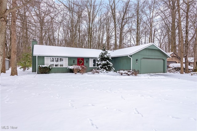 view of front of house with a garage and a chimney