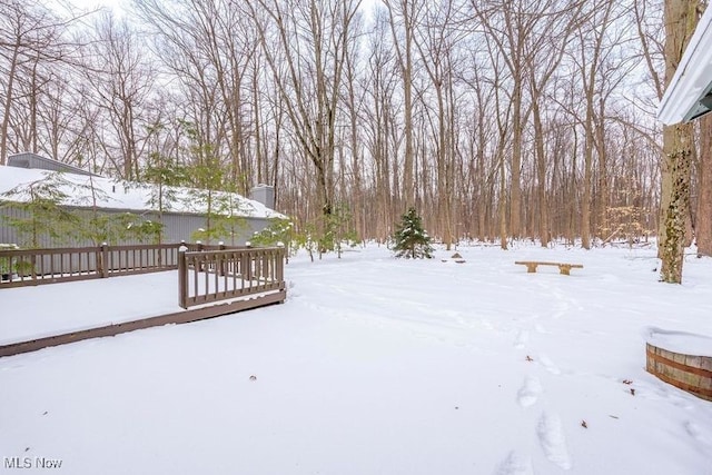 view of yard layered in snow