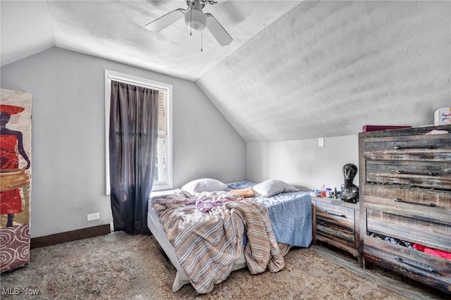 bedroom featuring ceiling fan, lofted ceiling, and carpet