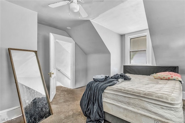 carpeted bedroom with ceiling fan and lofted ceiling