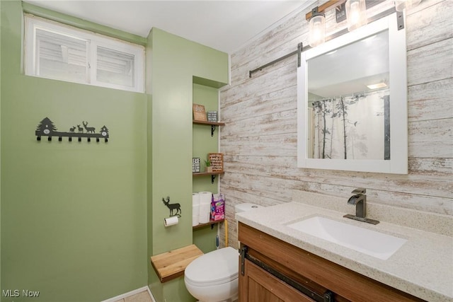 bathroom featuring wood walls, a shower with curtain, vanity, and toilet