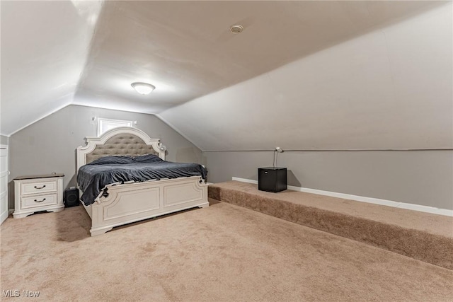 bedroom featuring carpet flooring and vaulted ceiling