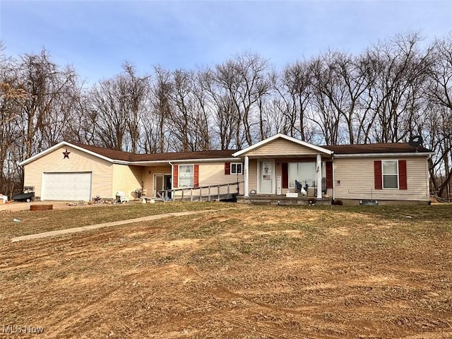 view of front facade with an attached garage, a front lawn, and a porch