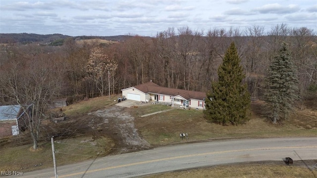 aerial view featuring a forest view