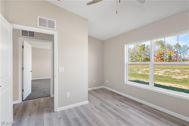 unfurnished bedroom with light wood-style floors, baseboards, visible vents, and ceiling fan