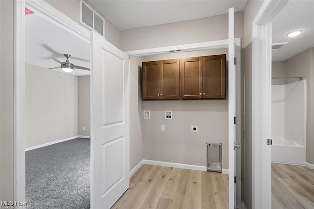 laundry area with cabinet space, baseboards, visible vents, hookup for a washing machine, and electric dryer hookup