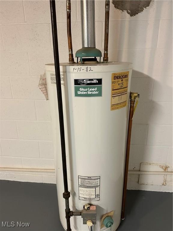 utility room featuring gas water heater