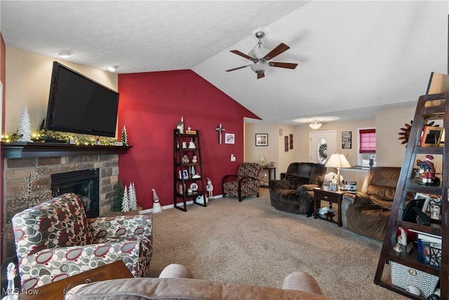 carpeted living room featuring lofted ceiling, ceiling fan, a fireplace, and baseboards