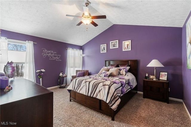 bedroom with vaulted ceiling, a textured ceiling, baseboards, and light colored carpet