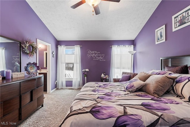 bedroom with lofted ceiling, a textured ceiling, light colored carpet, a ceiling fan, and baseboards