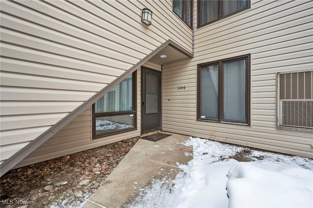 view of snow covered property entrance