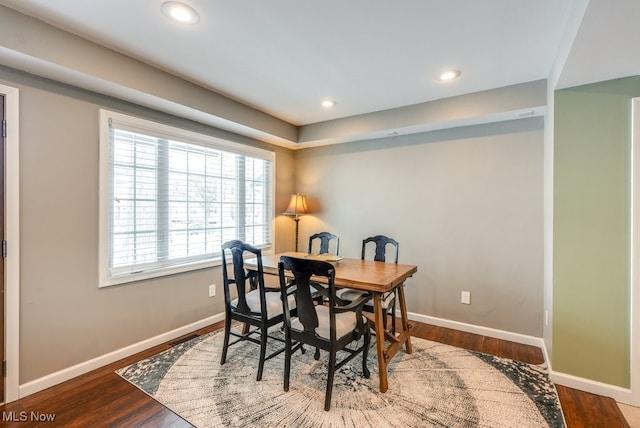 dining space with dark wood-style floors, recessed lighting, and baseboards