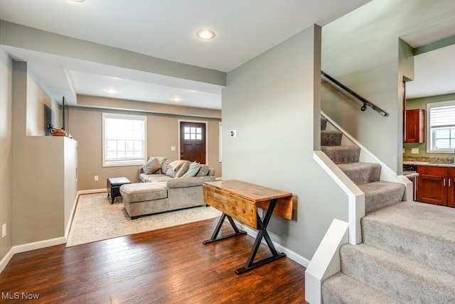 interior space featuring wood finished floors and baseboards