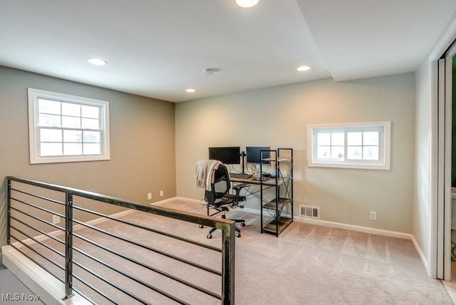 office featuring light carpet, baseboards, visible vents, and recessed lighting