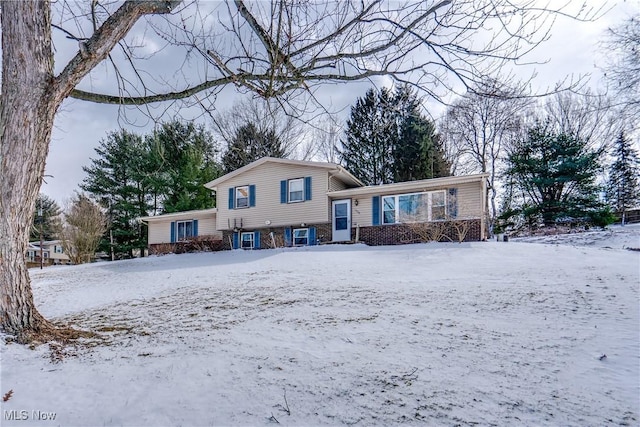 view of front of property featuring brick siding