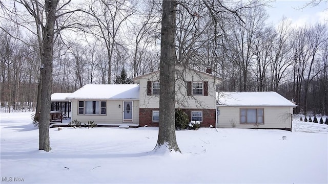 tri-level home with brick siding