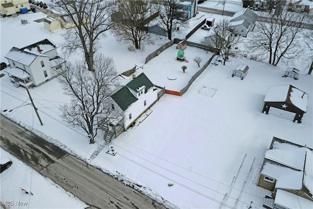 snowy aerial view featuring a residential view