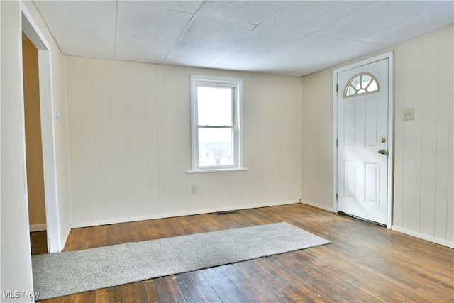 entrance foyer featuring wood finished floors and baseboards