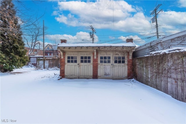 exterior space with a garage and fence