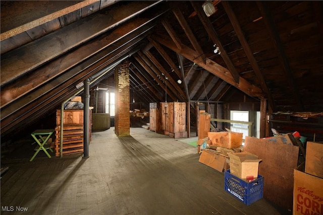 attic featuring an upstairs landing