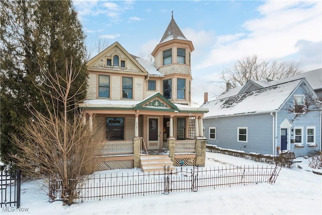 victorian-style house featuring a porch