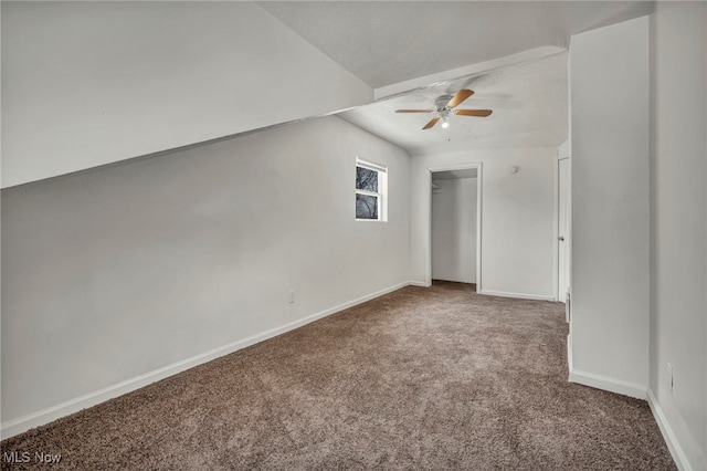 unfurnished bedroom with carpet, baseboards, ceiling fan, and a closet