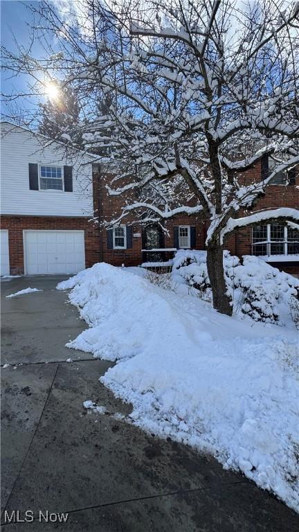 exterior space with driveway and a garage