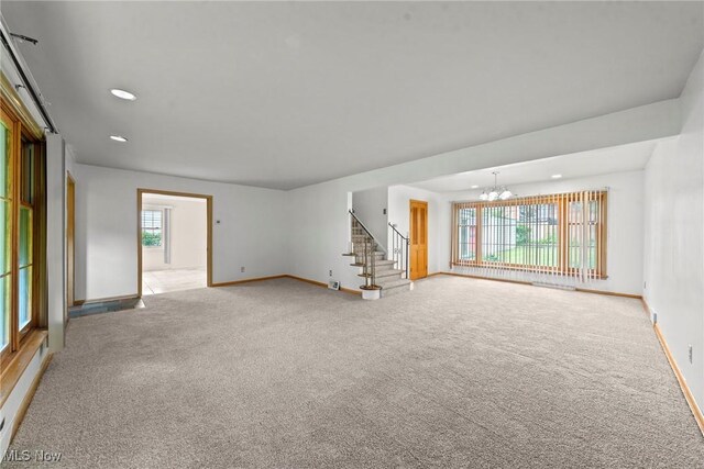 19951 Fairmount Blvd, Shaker Heights, OH 44118 - spare room with a chandelier, baseboards, light colored carpet, stairway, and recessed lighting