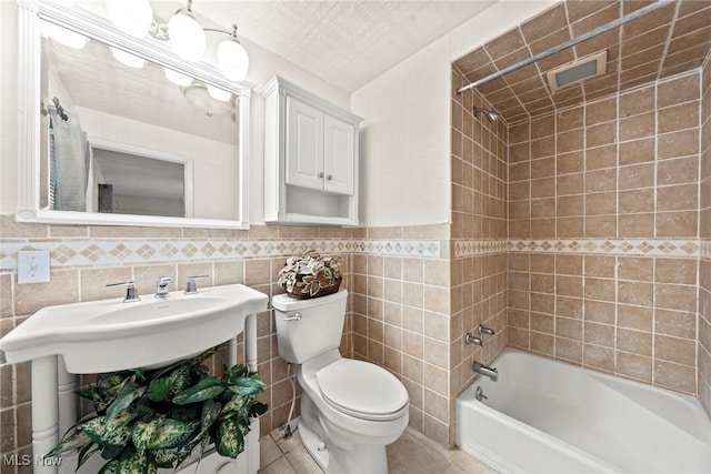 19951 Fairmount Blvd, Shaker Heights, OH 44118 - full bath with toilet, bathing tub / shower combination, tile walls, tile patterned flooring, and wainscoting