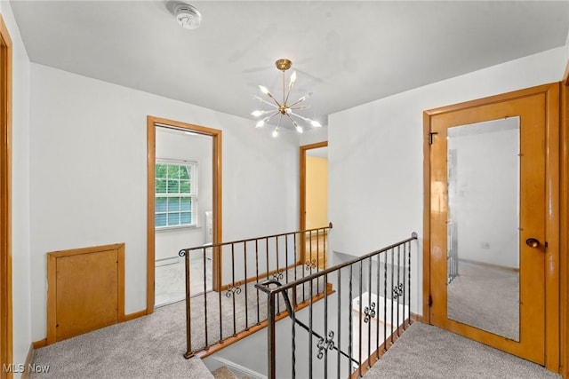 19951 Fairmount Blvd, Shaker Heights, OH 44118 - hall featuring an upstairs landing, a chandelier, carpet, and baseboards