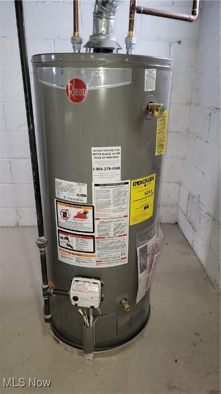 utility room featuring water heater