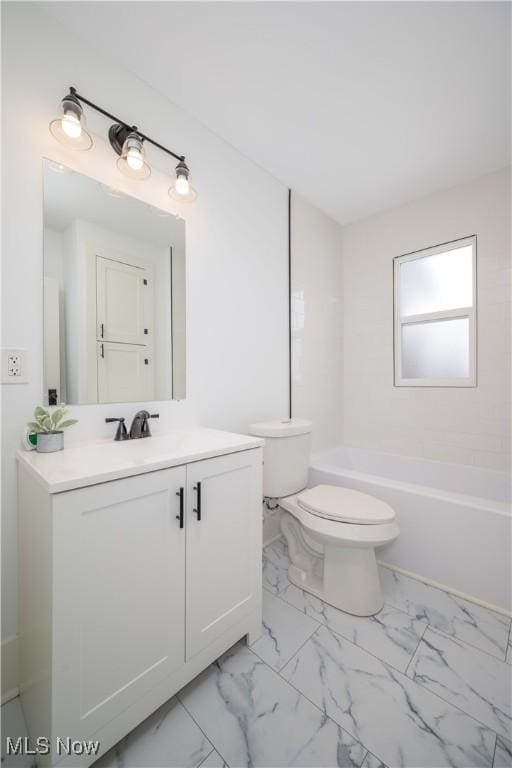 full bathroom featuring toilet, marble finish floor, bathtub / shower combination, and vanity