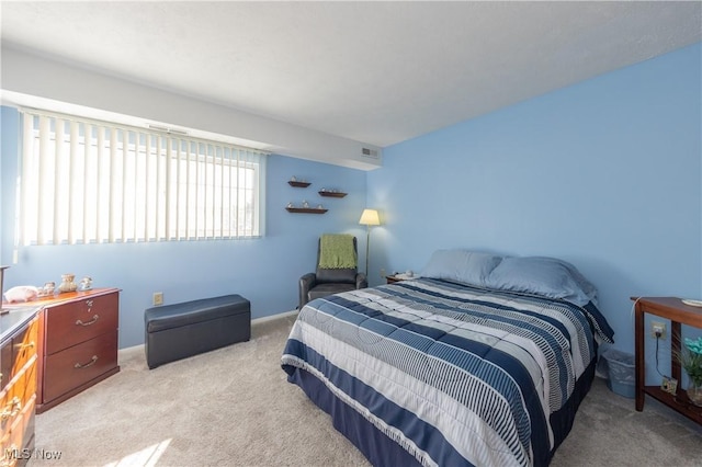 bedroom with light colored carpet