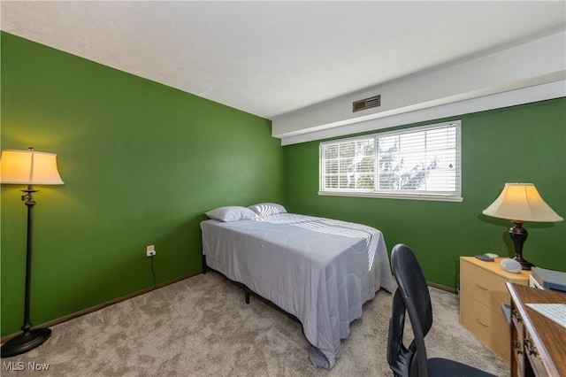 bedroom with visible vents and light colored carpet