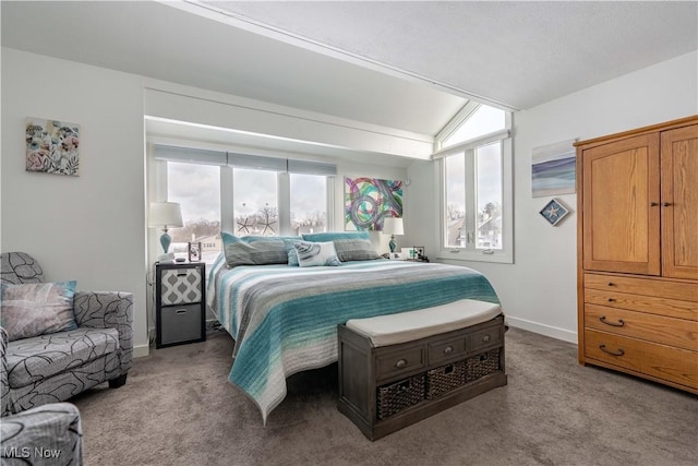 bedroom featuring light colored carpet and baseboards