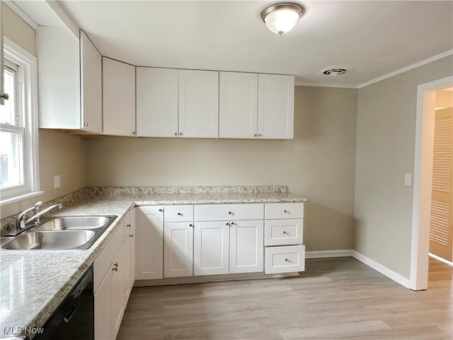 kitchen featuring baseboards, black dishwasher, white cabinetry, and a sink