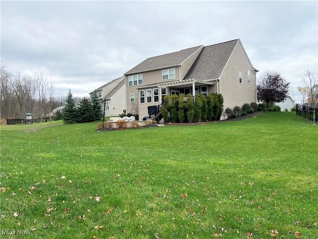 back of house featuring a yard