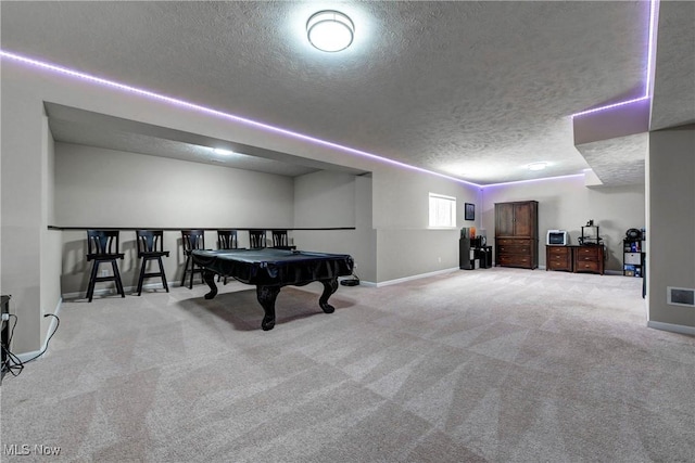 playroom with light carpet, billiards, visible vents, baseboards, and a textured ceiling